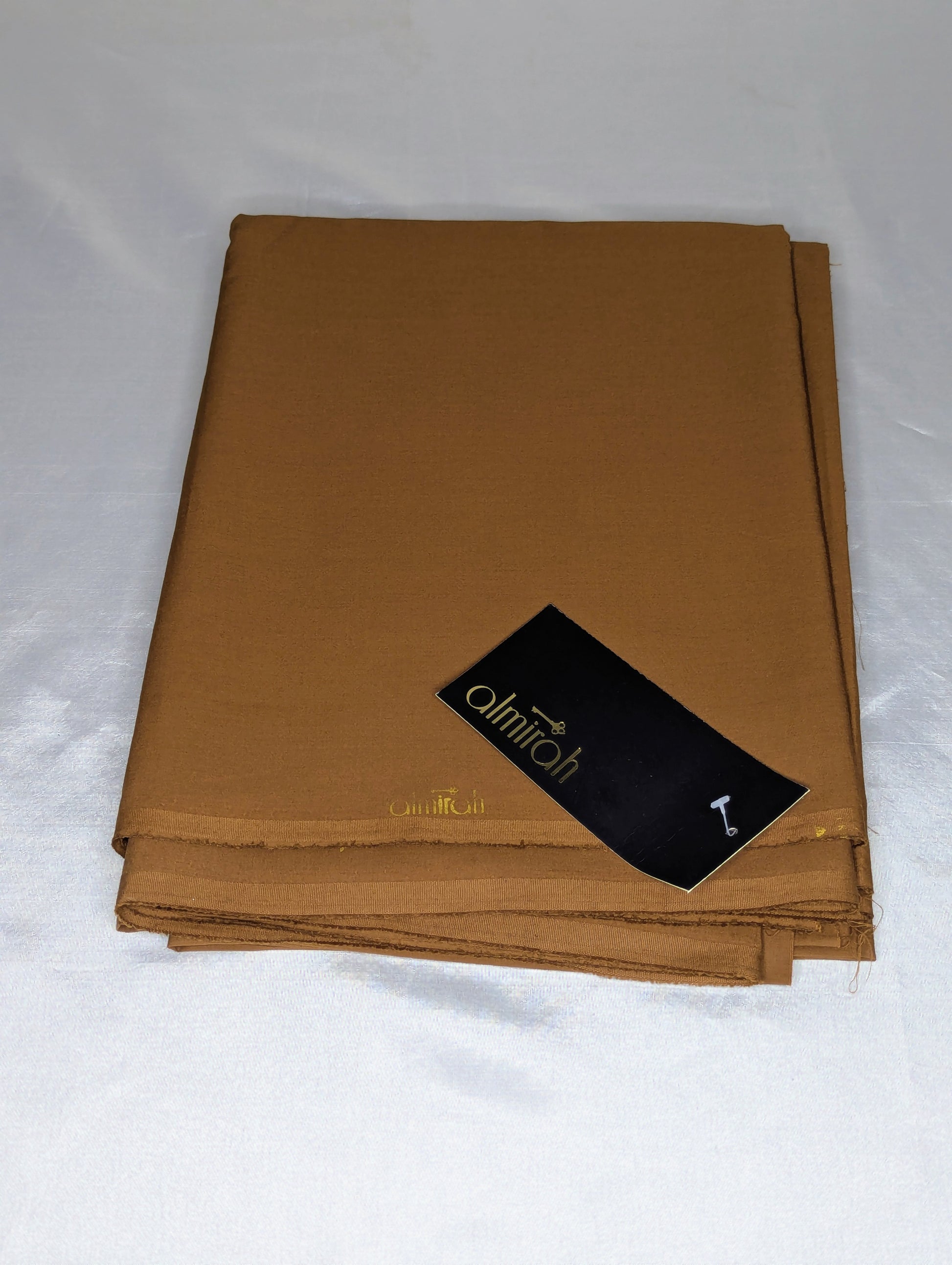 Brown fabric with a brand label on a white backgroundAlmira Fabric, Almira Wash and Wear, Unstitched Fabric, Plain Fabric, Wash and Wear Material, Summer Fabric, Formal Fabric, Casual Wear Fabric, Mens Fabric, Gents Wash and Wear, Plain Wash & Wear, Soft Fabric, Comfortable Fabric, Durable Cloth, Wrinkle-Free Fabric, Easy Care Fabric, Fine Quality Cloth, Unstitched Plain Suit, Solid Color Fabric, Polyester Viscose Blend, Smooth Finish Fabric, Shalwar Kameez Fabric, Kameez Shalwar Material, Kurta Fabric, Tro
