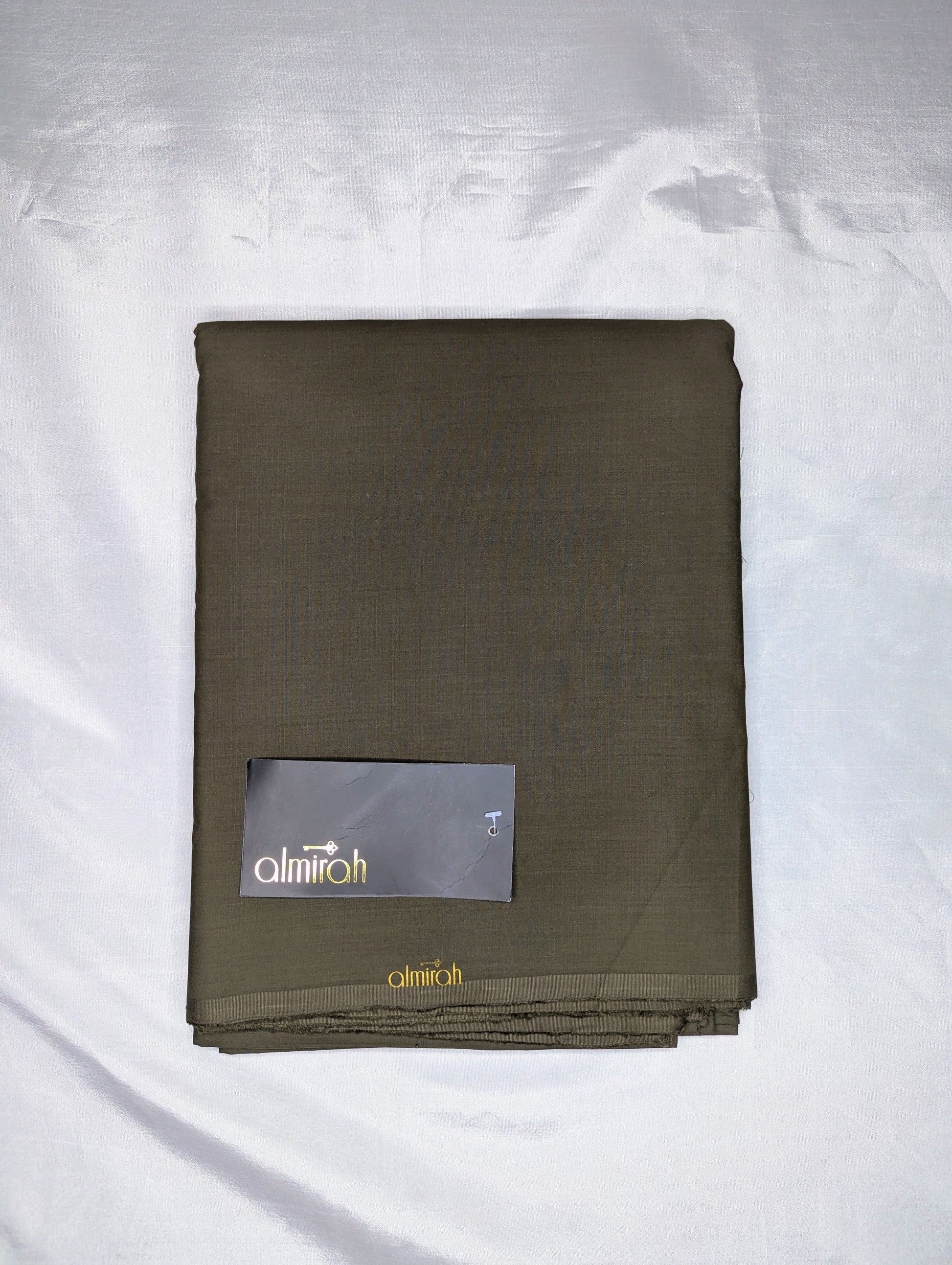 Folded brown fabric with a brand label on a white backgroundAlmira Fabric, Almira Wash and Wear, Unstitched Fabric, Plain Fabric, Wash and Wear Material, Summer Fabric, Formal Fabric, Casual Wear Fabric, Mens Fabric, Gents Wash and Wear, Plain Wash & Wear, Soft Fabric, Comfortable Fabric, Durable Cloth, Wrinkle-Free Fabric, Easy Care Fabric, Fine Quality Cloth, Unstitched Plain Suit, Solid Color Fabric, Polyester Viscose Blend, Smooth Finish Fabric, Shalwar Kameez Fabric, Kameez Shalwar Material, Kurta Fabr