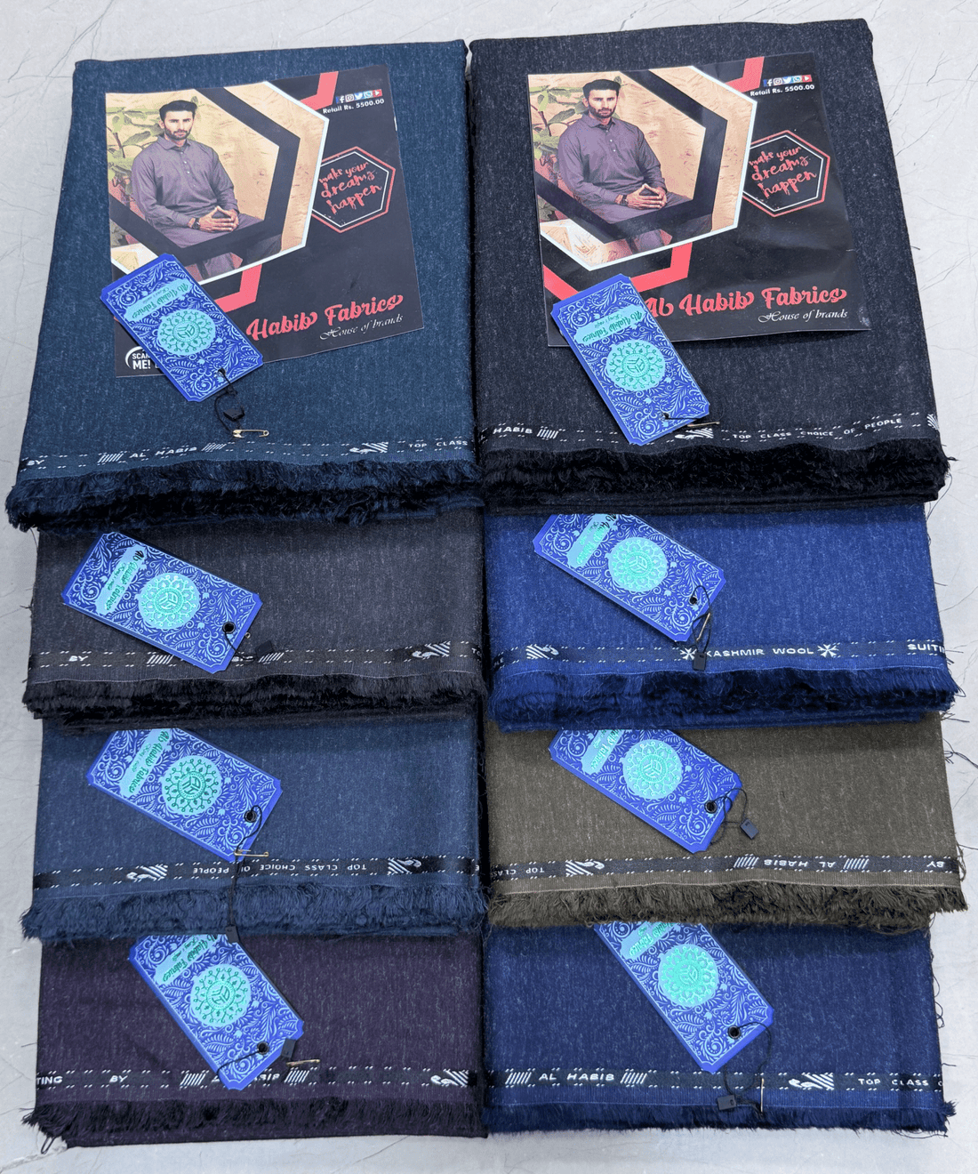 Stack of folded fabric with 'Nabil's Fabrics' branding on a white background**AlHabibFabrics, AlHabibWinter, King'sOutfit, TopClassChoice, AlHabib, KashmirWool, WoolFabric, PremiumWool, SoftWool, WarmFabric, UnstitchedWool, SuitingWool, Men'sSuiting, UnstitchedFabric, ShalwarKameezFabric, KurtaShalwarFabric, Men'sDressMaterial, PremiumSuit, LuxuryMenswear, ElegantFabric, FormalWearMen, BestWinterFabric, NavyBlue, CharcoalGrey, DarkBrown, DeepBlue, MaroonFabric, GreySuit, PlainColors, PakistaniFabric, Menswe