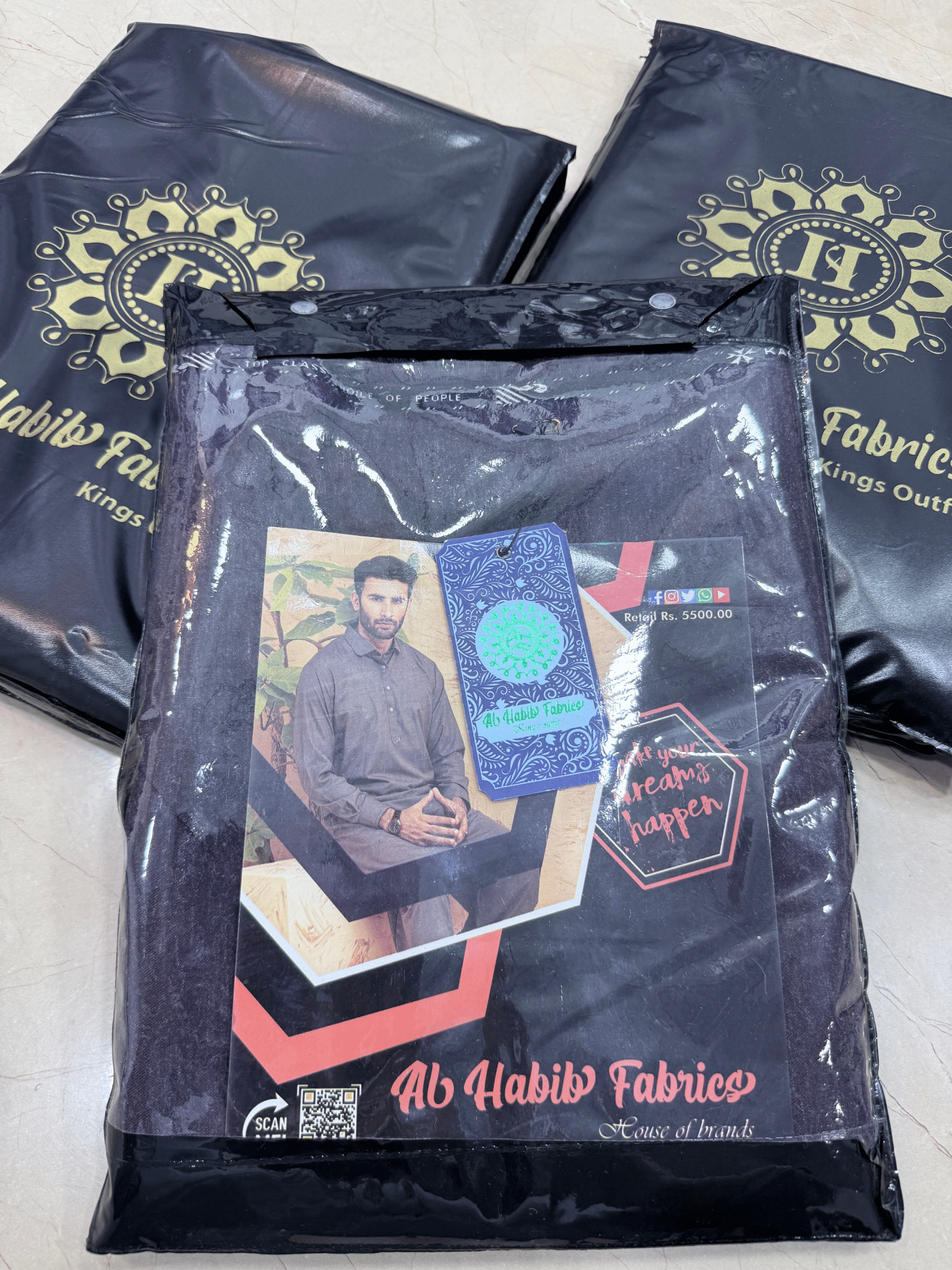 Packaged product from Ab Habib Fabrics with branding and product image.**AlHabibFabrics, AlHabibWinter, King'sOutfit, TopClassChoice, AlHabib, KashmirWool, WoolFabric, PremiumWool, SoftWool, WarmFabric, UnstitchedWool, SuitingWool, Men'sSuiting, UnstitchedFabric, ShalwarKameezFabric, KurtaShalwarFabric, Men'sDressMaterial, PremiumSuit, LuxuryMenswear, ElegantFabric, FormalWearMen, BestWinterFabric, NavyBlue, CharcoalGrey, DarkBrown, DeepBlue, MaroonFabric, GreySuit, PlainColors, PakistaniFabric, Menswear, W