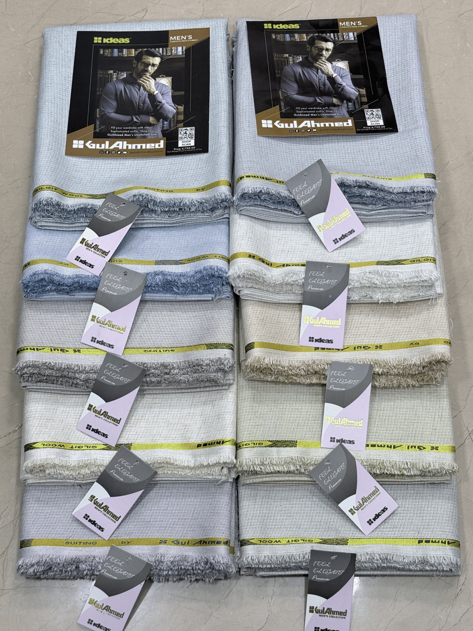 Set of folded men's shirts with Gul Ahmed branding on a tiled floor.GulAhmedMen,UnstitchedFabric,MensSuiting,GilgitWool,IdeasMens,PremiumFabricPakistan,WinterSuiting,GulAhmedSuits,SophisticatedOutfits,ShalwarKameezFabric, GulAhmedFabric,IdeasMen,UnstitchedSuits,MenWoolFabric,WinterCollection,MensDressMaterial,UnstitchedWoolSuit,GulAhmedOnline,MensEasternWear,PakistaniSuits, LuxuryMensFabric,FineWool,GilgitWoolSuiting,ElegantPresence,ClassicMenswear,UnstitchedWinter,FormalSuiting,GentlemanFabric,GulAhmedNewC