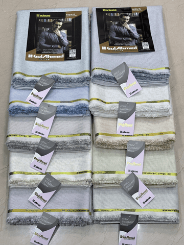 Set of folded men's shirts with Gul Ahmed branding on a tiled floor.GulAhmedMen,UnstitchedFabric,MensSuiting,GilgitWool,IdeasMens,PremiumFabricPakistan,WinterSuiting,GulAhmedSuits,SophisticatedOutfits,ShalwarKameezFabric, GulAhmedFabric,IdeasMen,UnstitchedSuits,MenWoolFabric,WinterCollection,MensDressMaterial,UnstitchedWoolSuit,GulAhmedOnline,MensEasternWear,PakistaniSuits, LuxuryMensFabric,FineWool,GilgitWoolSuiting,ElegantPresence,ClassicMenswear,UnstitchedWinter,FormalSuiting,GentlemanFabric,GulAhmedNewC