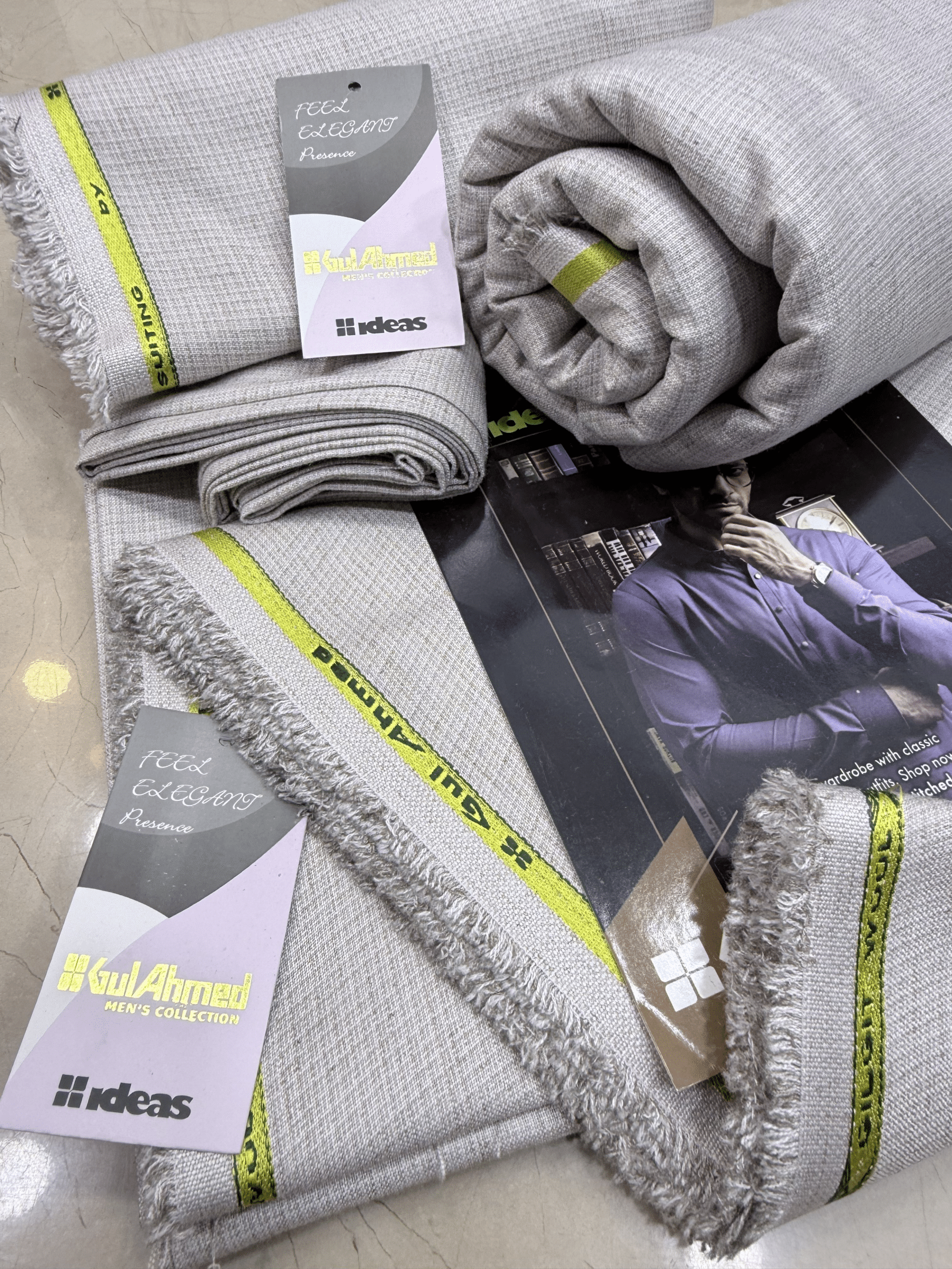 Gray textured towels with yellow accents on a magazineGulAhmedMen,UnstitchedFabric,MensSuiting,GilgitWool,IdeasMens,PremiumFabricPakistan,WinterSuiting,GulAhmedSuits,SophisticatedOutfits,ShalwarKameezFabric, GulAhmedFabric,IdeasMen,UnstitchedSuits,MenWoolFabric,WinterCollection,MensDressMaterial,UnstitchedWoolSuit,GulAhmedOnline,MensEasternWear,PakistaniSuits, LuxuryMensFabric,FineWool,GilgitWoolSuiting,ElegantPresence,ClassicMenswear,UnstitchedWinter,FormalSuiting,GentlemanFabric,GulAhmedNewCollection,Late