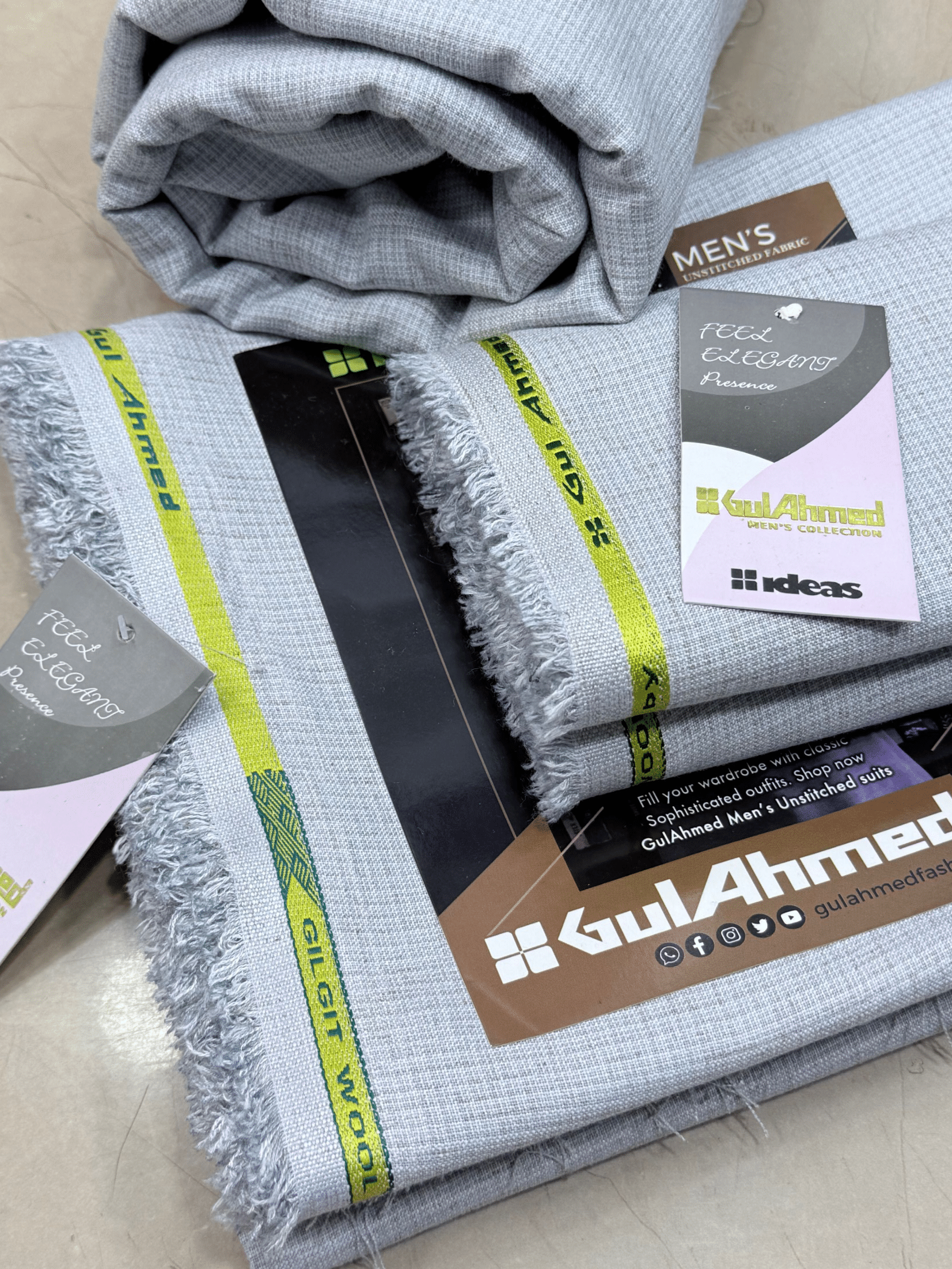 Gray fabric with fringes and Gul Ahmed branding on a beige surfaceGulAhmedMen,UnstitchedFabric,MensSuiting,GilgitWool,IdeasMens,PremiumFabricPakistan,WinterSuiting,GulAhmedSuits,SophisticatedOutfits,ShalwarKameezFabric, GulAhmedFabric,IdeasMen,UnstitchedSuits,MenWoolFabric,WinterCollection,MensDressMaterial,UnstitchedWoolSuit,GulAhmedOnline,MensEasternWear,PakistaniSuits, LuxuryMensFabric,FineWool,GilgitWoolSuiting,ElegantPresence,ClassicMenswear,UnstitchedWinter,FormalSuiting,GentlemanFabric,GulAhmedNewCol