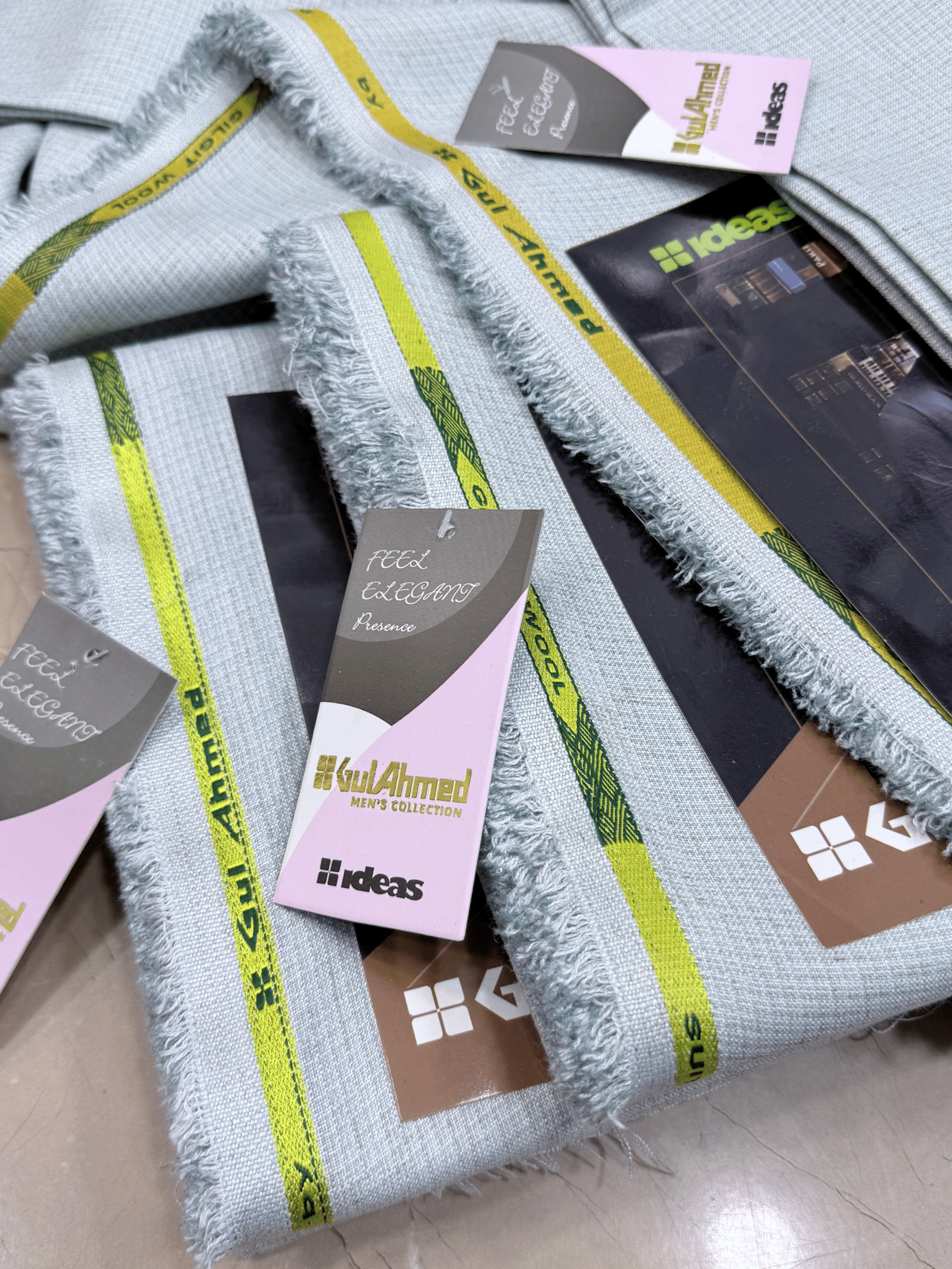 Gray towels with green stripes and Gul Ahmed branding on a light GulAhmedMen,UnstitchedFabric,MensSuiting,GilgitWool,IdeasMens,PremiumFabricPakistan,WinterSuiting,GulAhmedSuits,SophisticatedOutfits,ShalwarKameezFabric, GulAhmedFabric,IdeasMen,UnstitchedSuits,MenWoolFabric,WinterCollection,MensDressMaterial,UnstitchedWoolSuit,GulAhmedOnline,MensEasternWear,PakistaniSuits, LuxuryMensFabric,FineWool,GilgitWoolSuiting,ElegantPresence,ClassicMenswear,UnstitchedWinter,FormalSuiting,GentlemanFabric,GulAhbackground